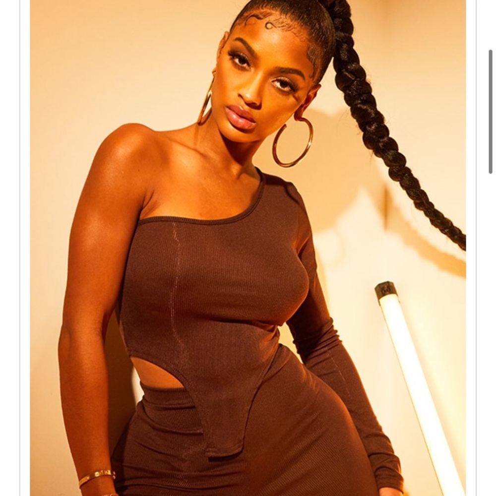 Two Piece Set. NEVER worn. Still has all tags. Size 4 in top & bottom.